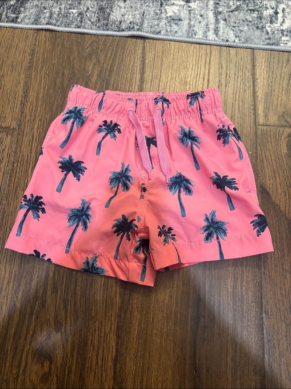 Kids' Pink Palm Print Swim Trunks